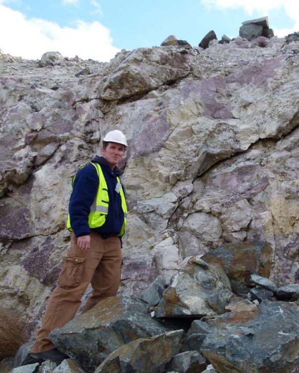 Peter Downes surrounded by purple lepidolite at the Mt Cattlin lithium mine